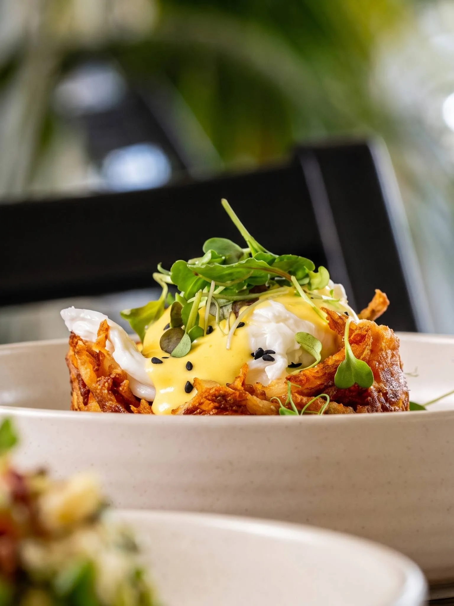 A potato rosti with poached egg and hollandaise