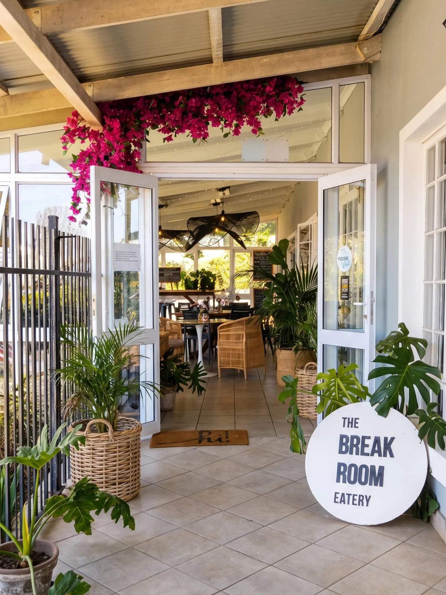 The front doors under the bougainvillea